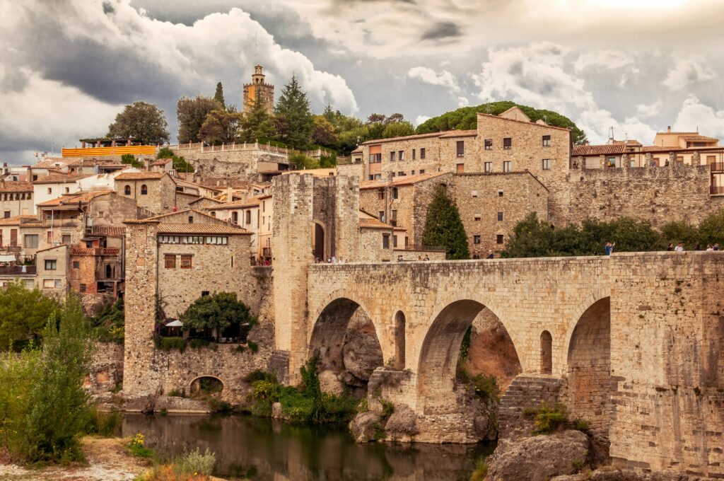 Scenic view of the medieval bridge and stone buildings in Besalú, Catalonia.